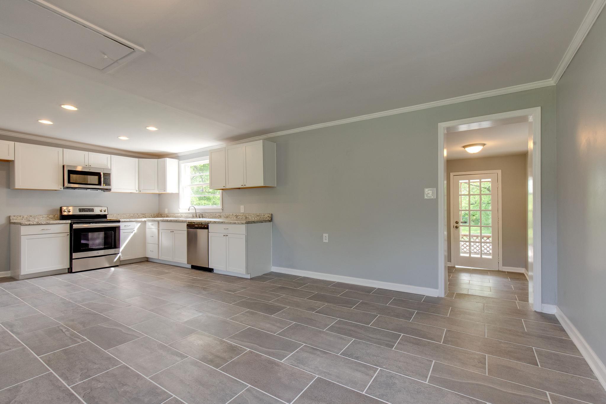 1008 Neelys Bend Road Madison, TN 37115 - Photo 10 of 26 a large kitchen with cabinets and stainless steel appliances