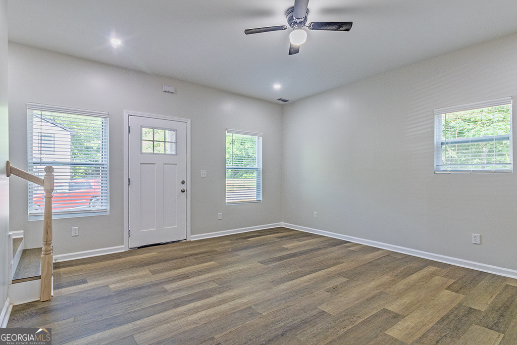 789 Main Street Macon, GA 31217 - Photo 6 of 19 wooden floor in an empty room with a window