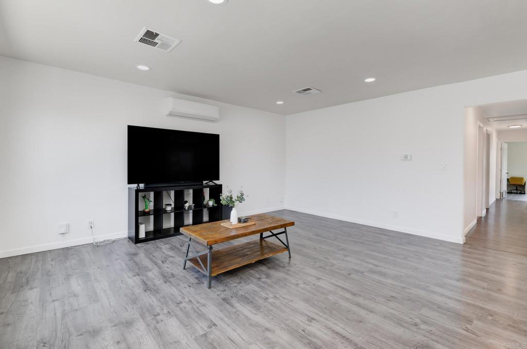 611 San Juhn Street Spring Valley, CA 91977 - Photo 11 of 25 a living room with furniture and a flat screen tv