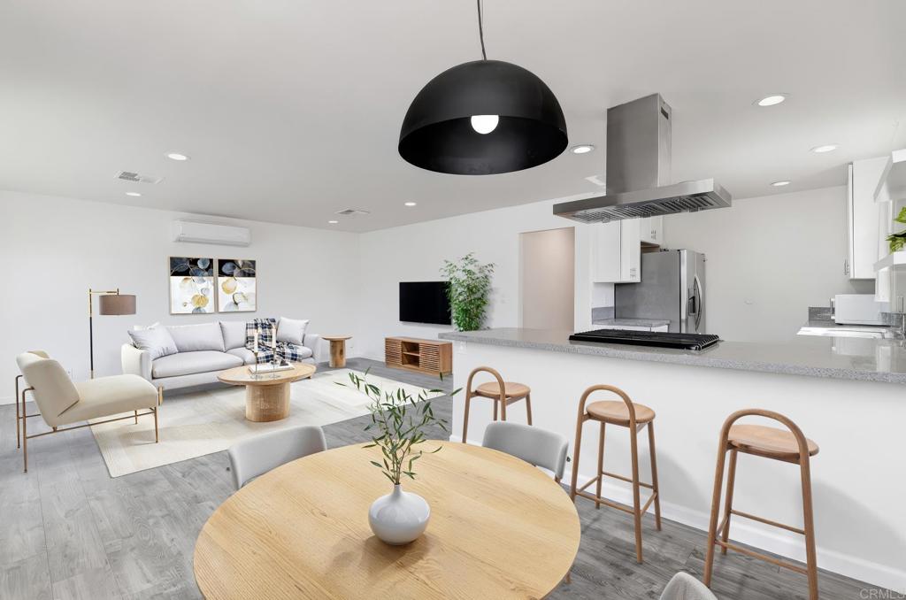611 San Juhn Street Spring Valley, CA 91977 - Photo 2 of 25 a living room with furniture kitchen view and a large mirror
