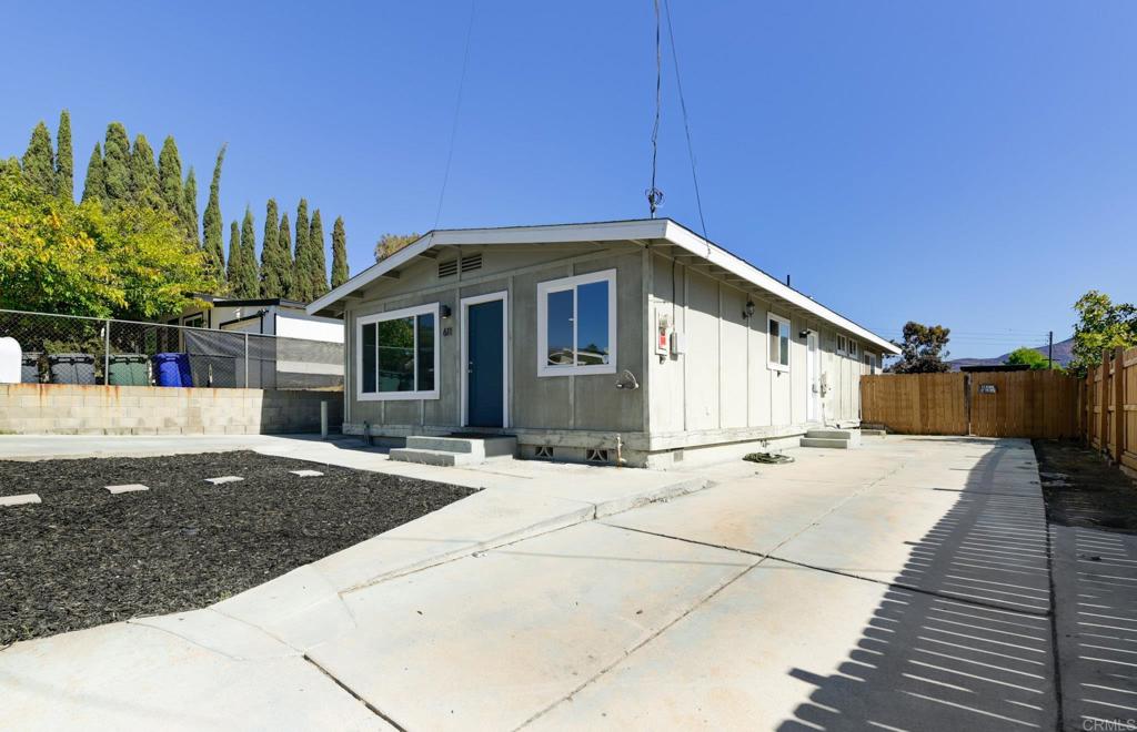 611 San Juhn Street Spring Valley, CA 91977 - Photo 21 of 25 a front view of a house with a yard