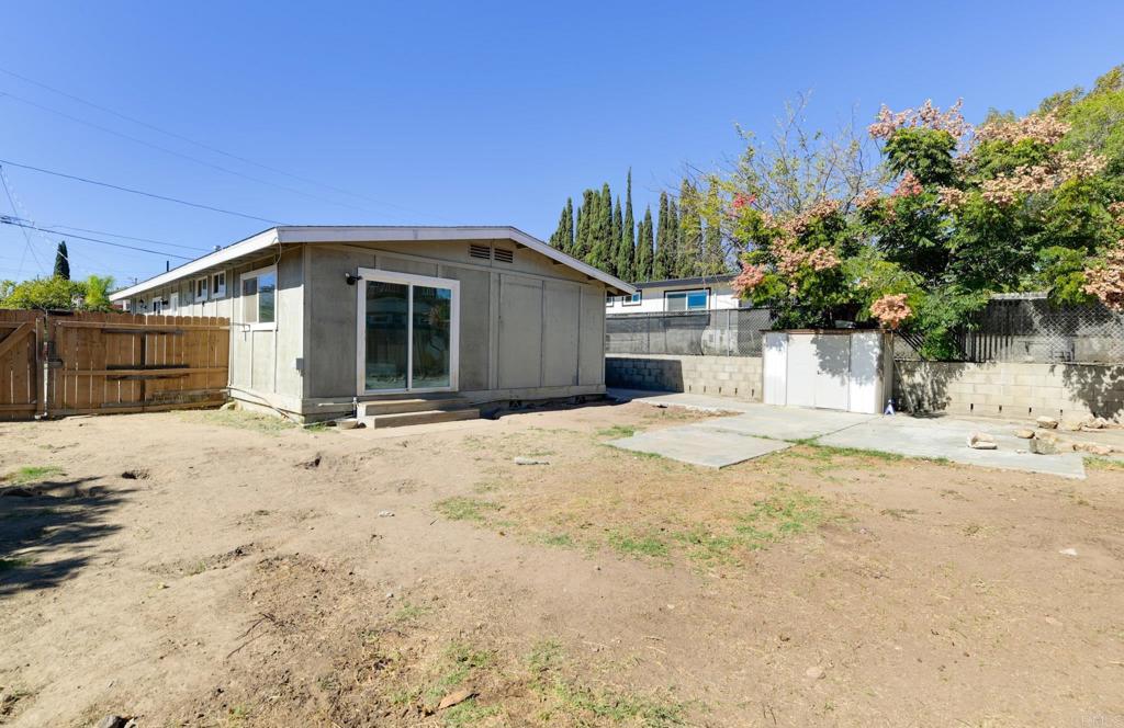 611 San Juhn Street Spring Valley, CA 91977 - Photo 23 of 25 a front view of a house with a yard covered with snow in front of it