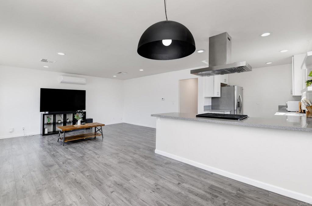 611 San Juhn Street Spring Valley, CA 91977 - Photo 6 of 25 a living room with furniture and a flat screen tv