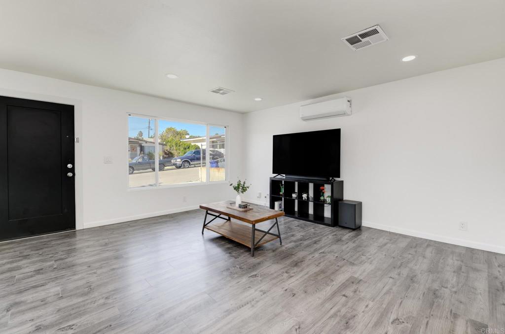 611 San Juhn Street Spring Valley, CA 91977 - Photo 8 of 25 a living room with furniture and a flat screen tv