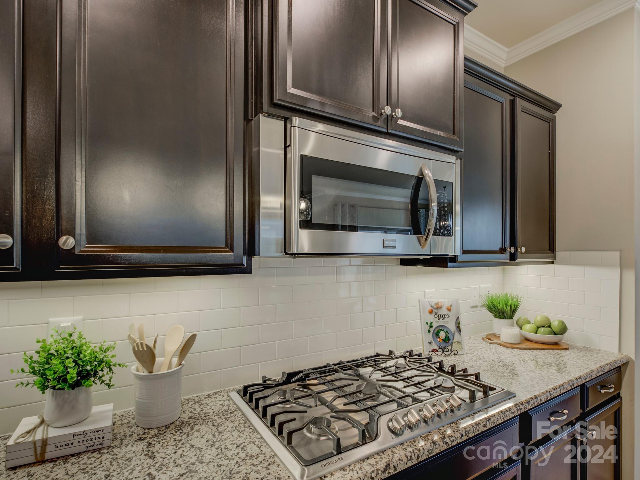 405 Cotton Field Road Indian Land, SC 29707 - Photo 17 of 48 a kitchen with a stove and a microwave