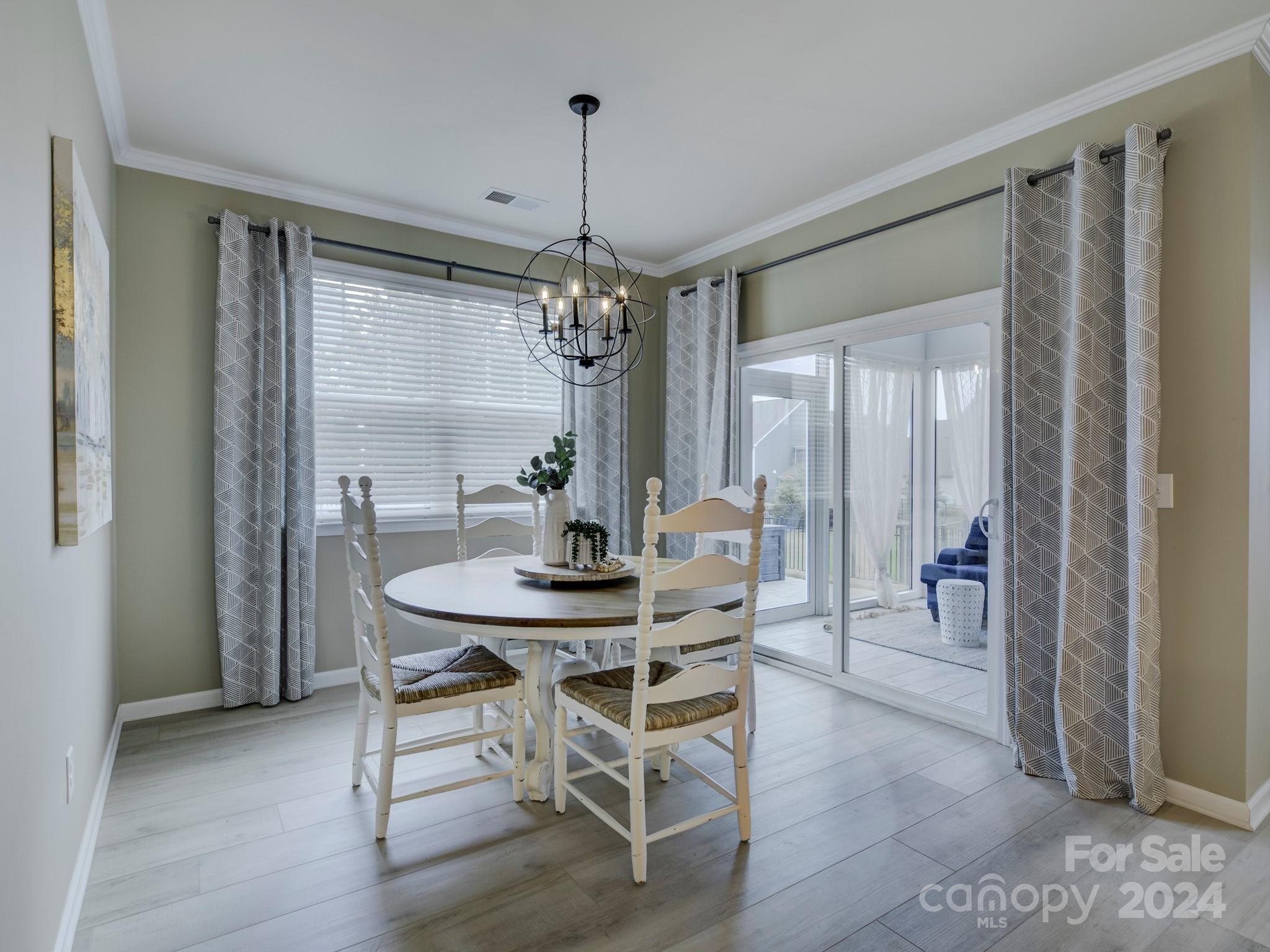 405 Cotton Field Road Indian Land, SC 29707 - Photo 18 of 48 a view of a dining room with furniture and chandelier