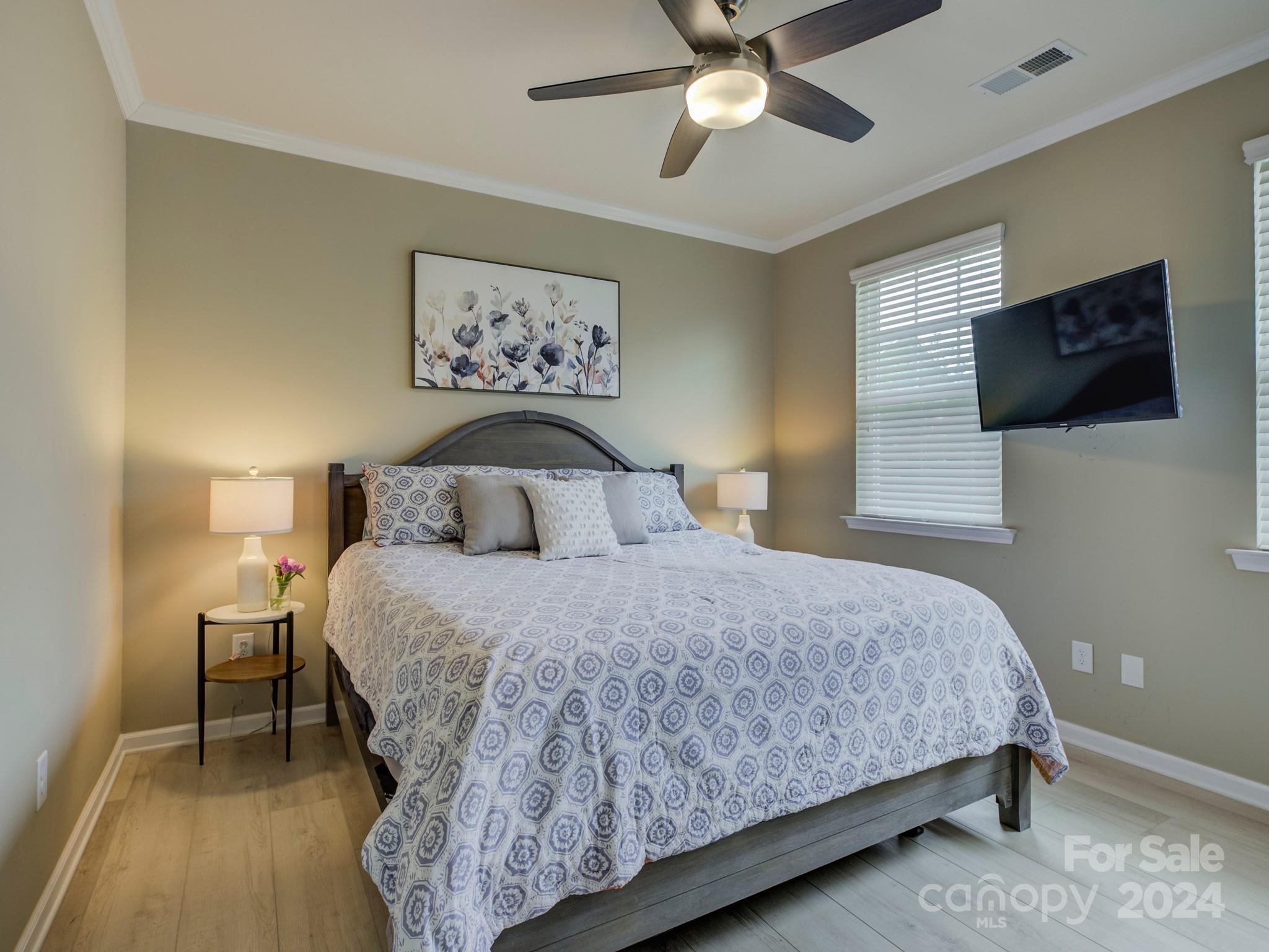 405 Cotton Field Road Indian Land, SC 29707 - Photo 22 of 48 a bedroom with a bed and a flat screen tv