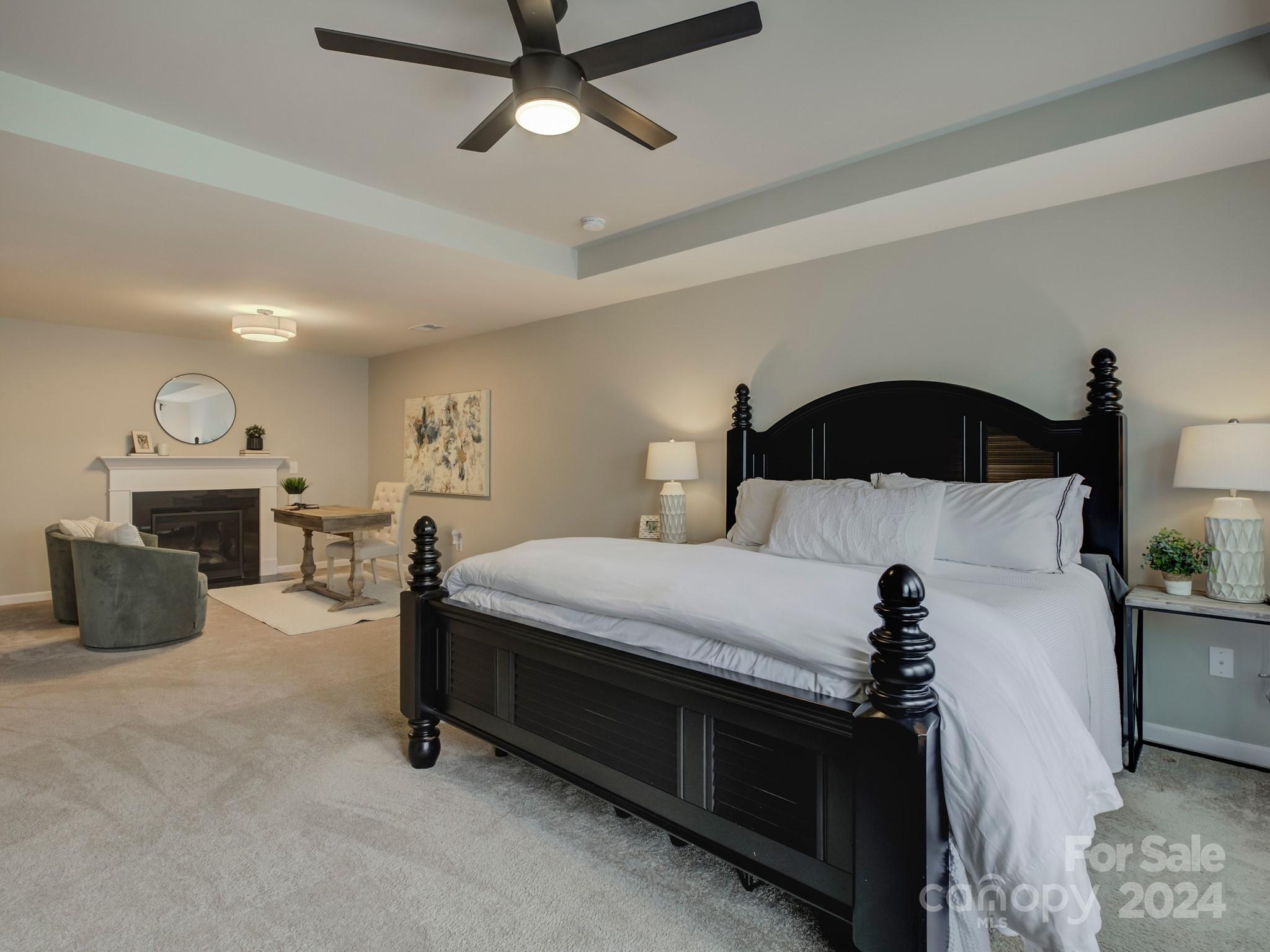 405 Cotton Field Road Indian Land, SC 29707 - Photo 25 of 48 a bedroom with a bed and a chandelier