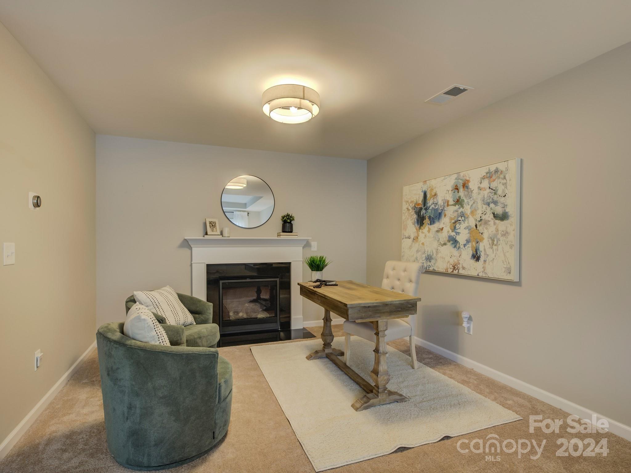 405 Cotton Field Road Indian Land, SC 29707 - Photo 26 of 48 a living room with furniture and a fireplace