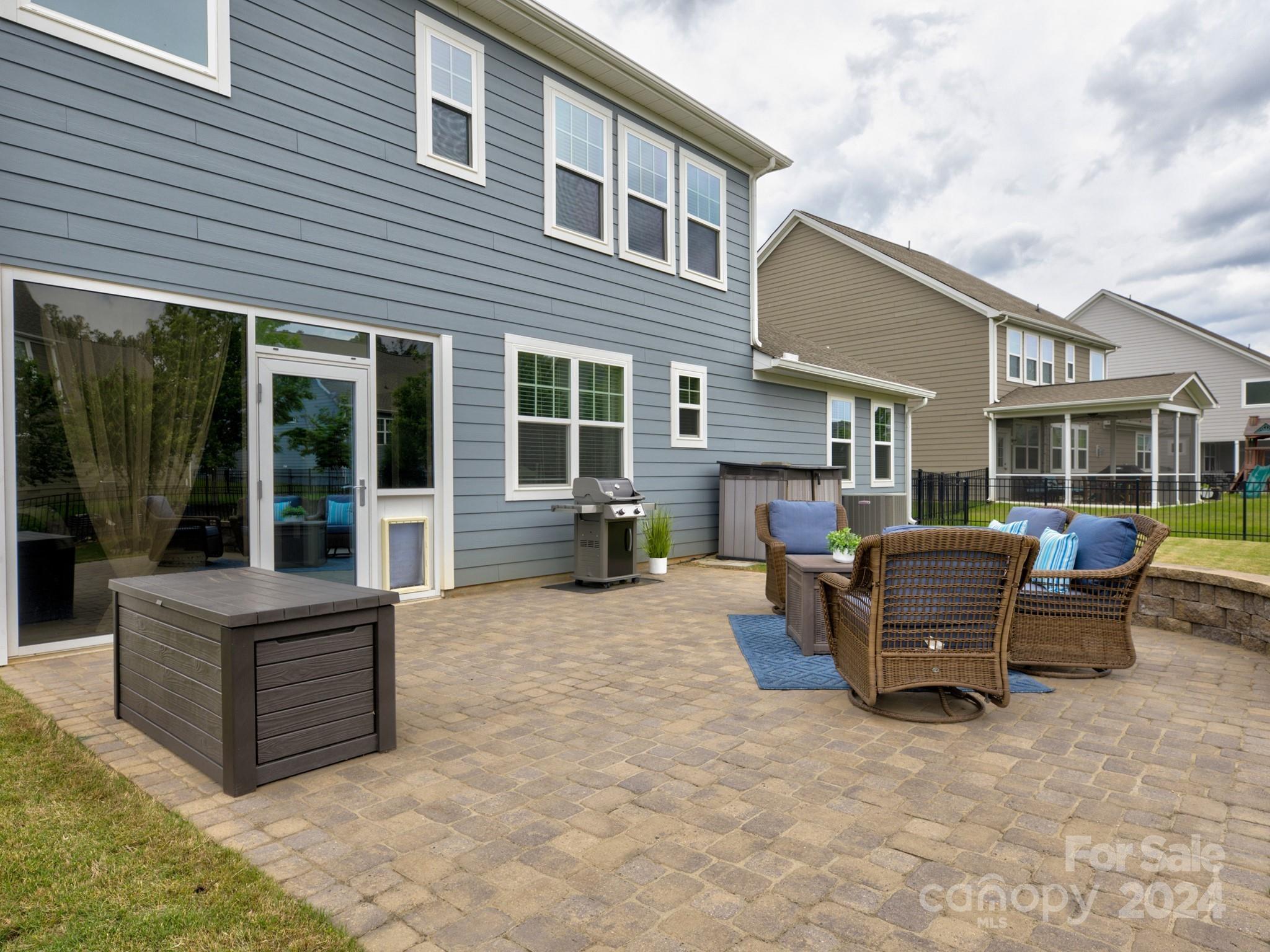 405 Cotton Field Road Indian Land, SC 29707 - Photo 39 of 48 a patio with couches and a barbeque