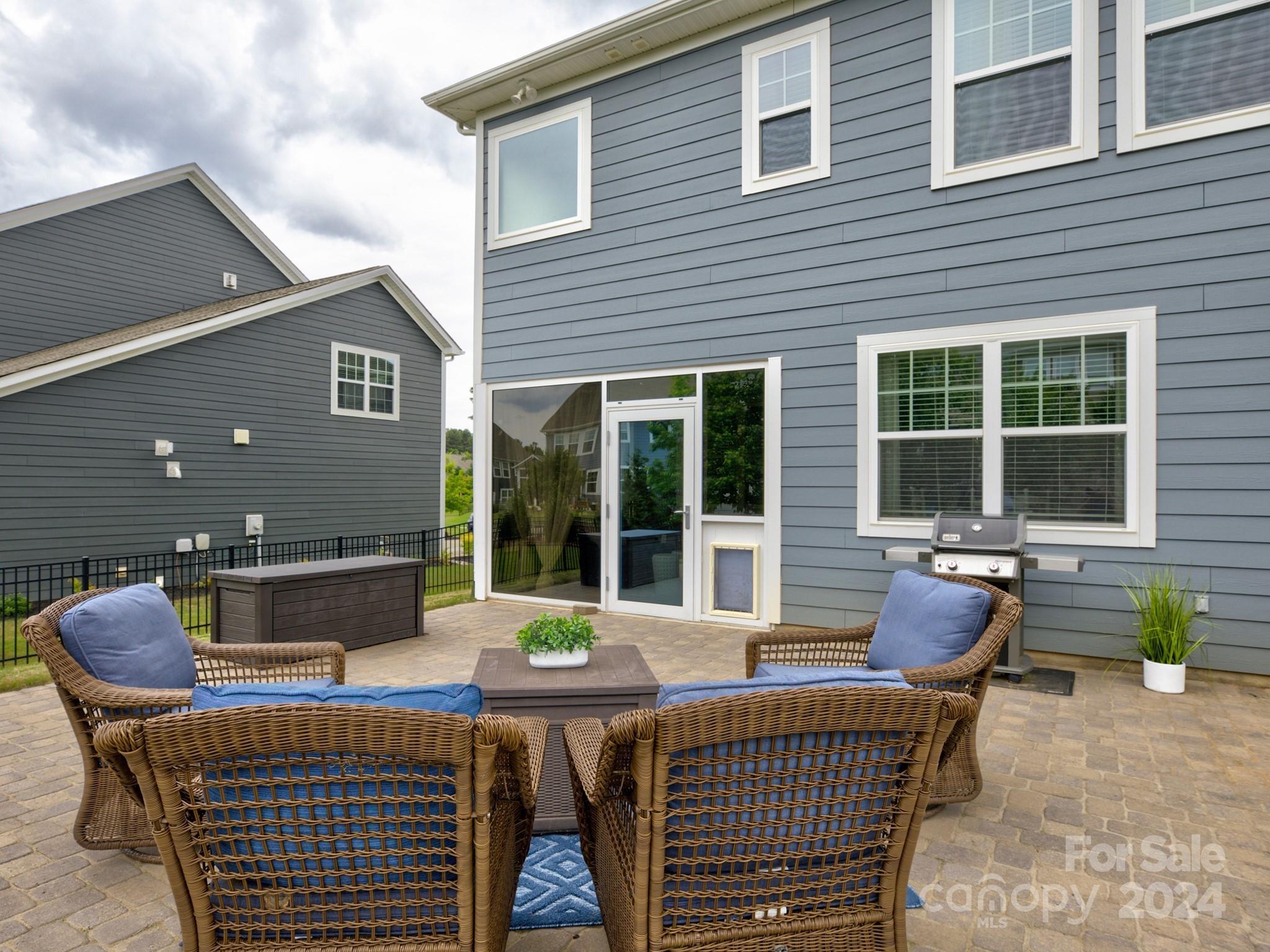 405 Cotton Field Road Indian Land, SC 29707 - Photo 41 of 48 a roof deck with a table and chairs and potted plants