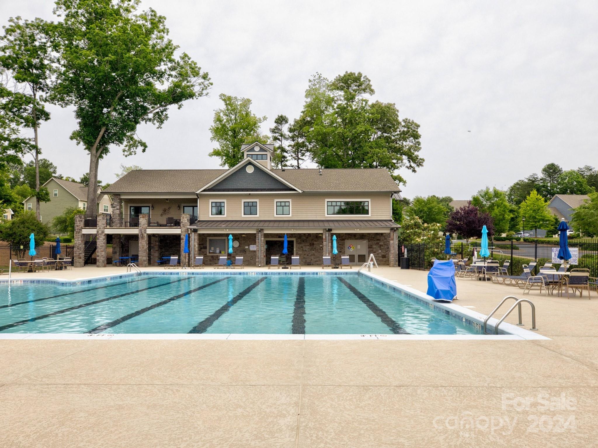 405 Cotton Field Road Indian Land, SC 29707 - Photo 45 of 48 a view of a white house with a big yard and potted plants