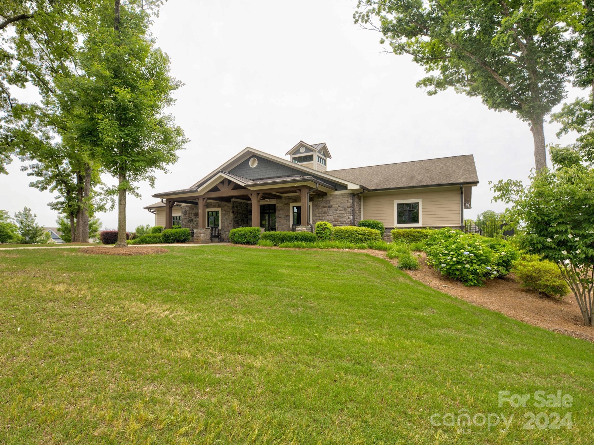 405 Cotton Field Road Indian Land, SC 29707 - Photo 47 of 48 a front view of a house with a garden