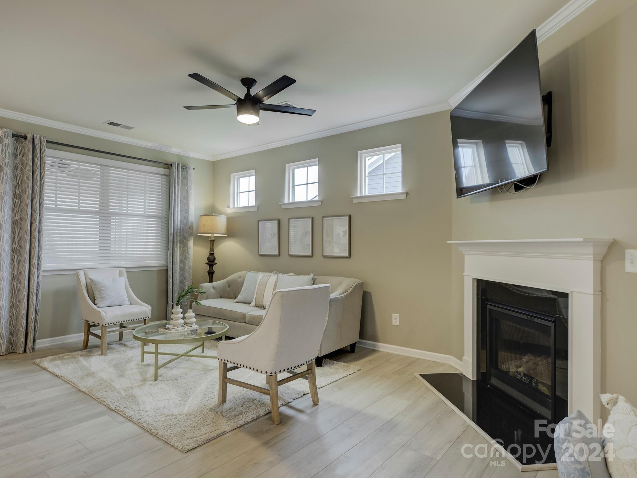 405 Cotton Field Road Indian Land, SC 29707 - Photo 10 of 48 a living room with furniture and a fireplace