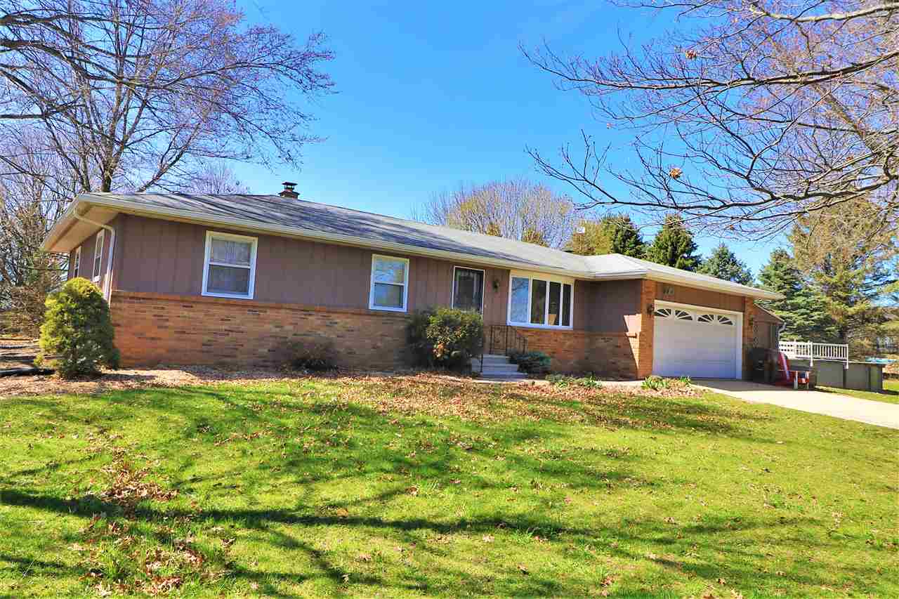 16214 Anderson Road Davis, IL 61019 - Photo 1 of 27 a front view of house with yard and trees in the background