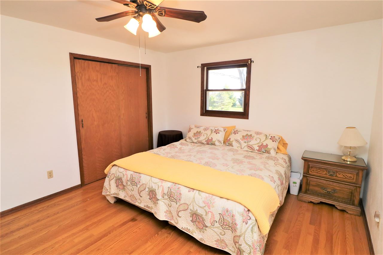 16214 Anderson Road Davis, IL 61019 - Photo 13 of 27 a bedroom with a bed and a window