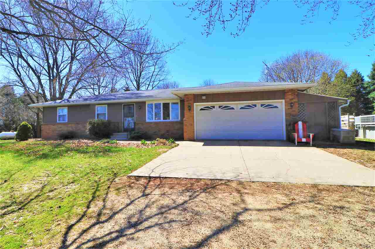 16214 Anderson Road Davis, IL 61019 - Photo 2 of 27 a front view of a house with a yard and garage