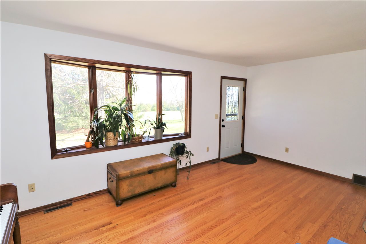 16214 Anderson Road Davis, IL 61019 - Photo 4 of 27 a view of a room with wooden floor and a window