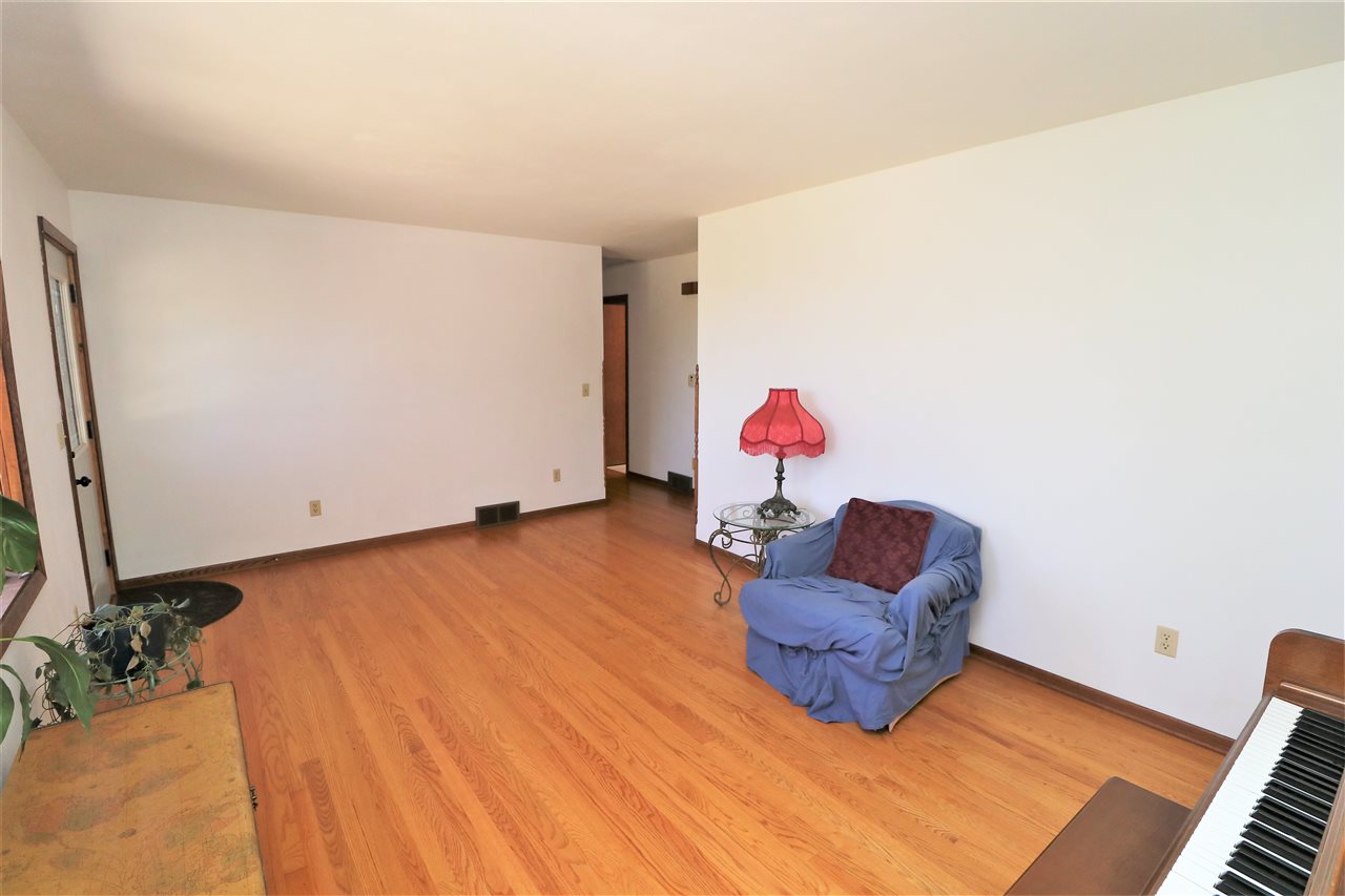 16214 Anderson Road Davis, IL 61019 - Photo 5 of 27 a living room with a couch and a flat screen tv