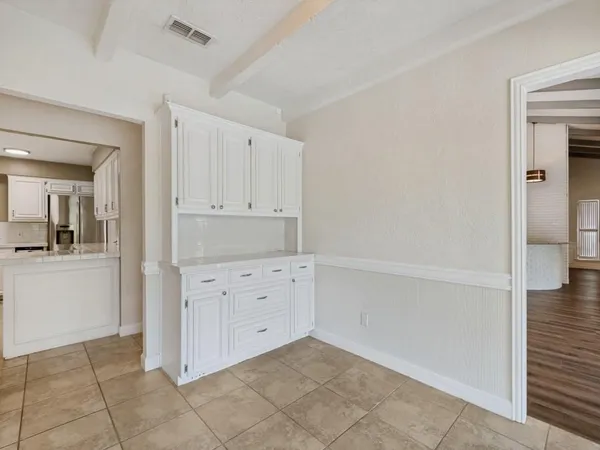 a bathroom with a tub shower and sink