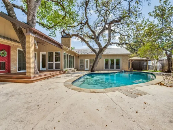 a backyard of a house with lots of green space
