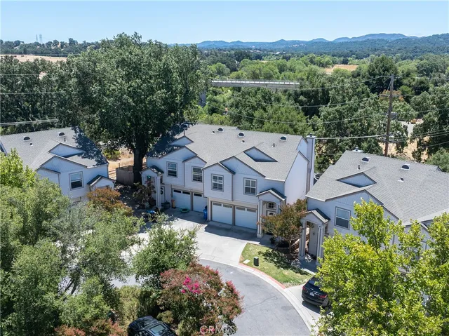 an aerial view of a house with a garden