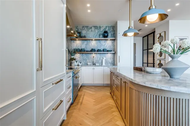 a bathroom with a sink a mirror and shower