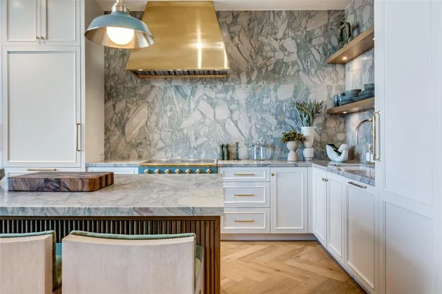 a kitchen with a sink and cabinets