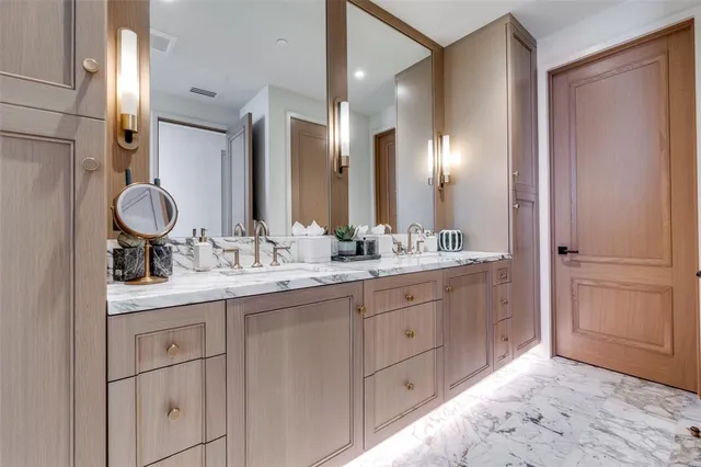 a bathroom with a double vanity sink and a mirror