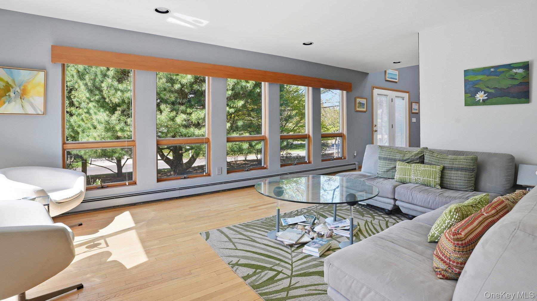 145 Osprey Nest Road Greenport, NY 11944 - Photo 12 of 40 Family Room with wall of windows!