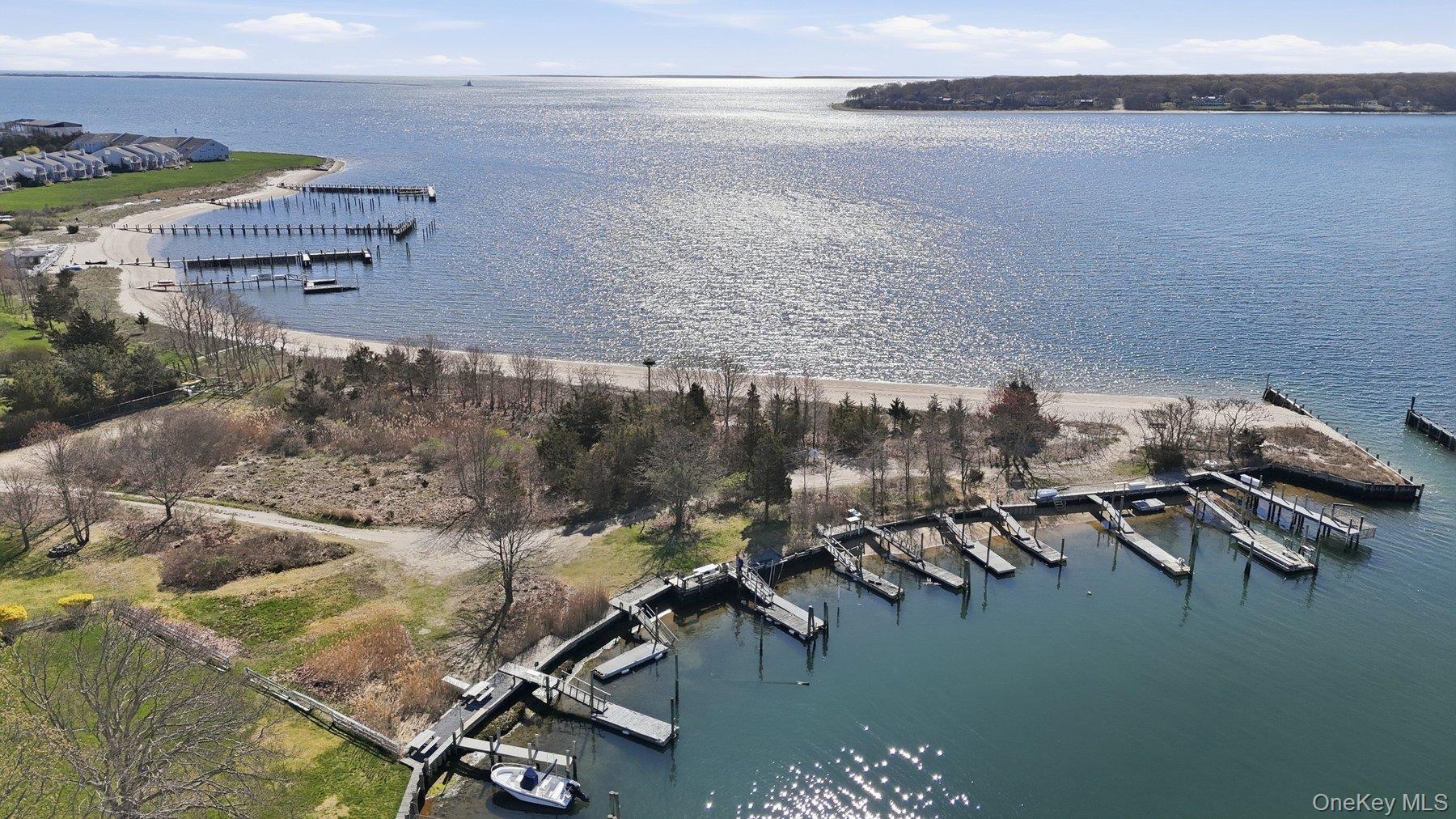 145 Osprey Nest Road Greenport, NY 11944 - Photo 36 of 40 Aerial View of Community Beach, Dock and the Peconic Bay