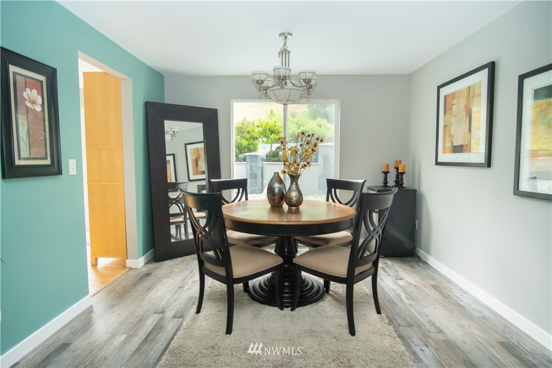 7215 South Rustic Road Seattle, WA 98178 - Photo 11 of 32 a view of a dining room with furniture window and outside view
