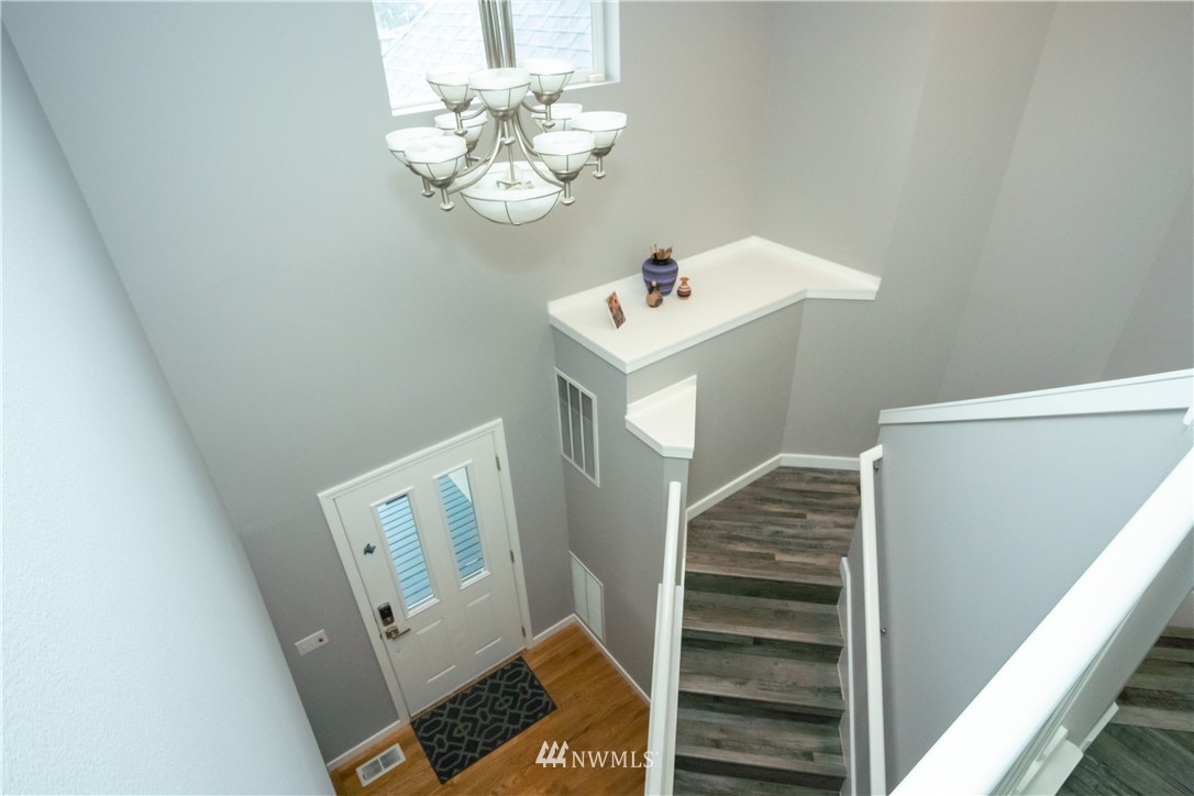 7215 South Rustic Road Seattle, WA 98178 - Photo 21 of 32 a view of an entryway with wooden floor