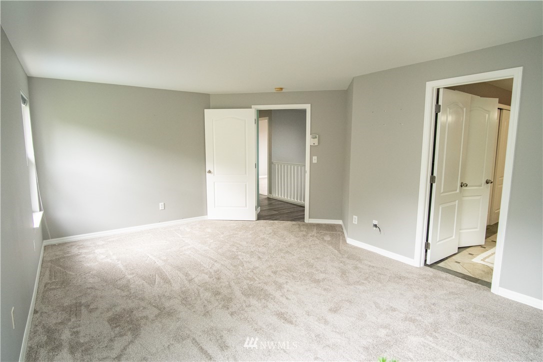 7215 South Rustic Road Seattle, WA 98178 - Photo 22 of 32 an empty room with a natural light