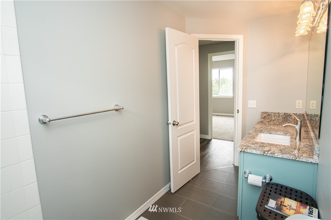 7215 South Rustic Road Seattle, WA 98178 - Photo 26 of 32 a view of a hallway and a livingroom with furniture