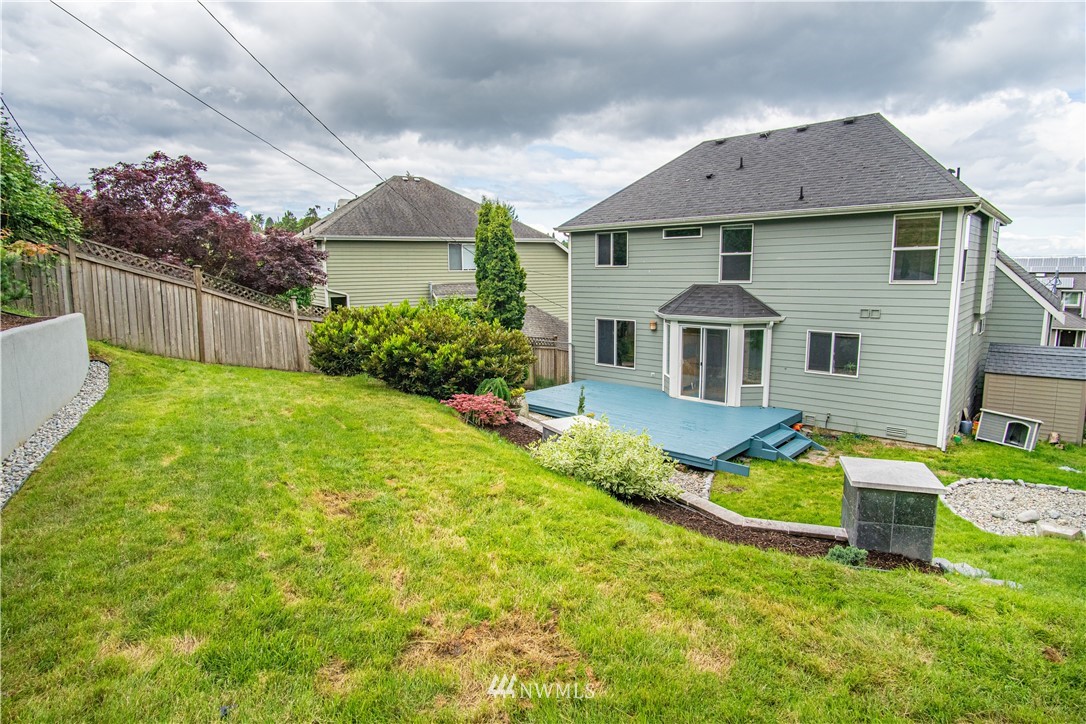 7215 South Rustic Road Seattle, WA 98178 - Photo 30 of 32 a front view of a house with a yard