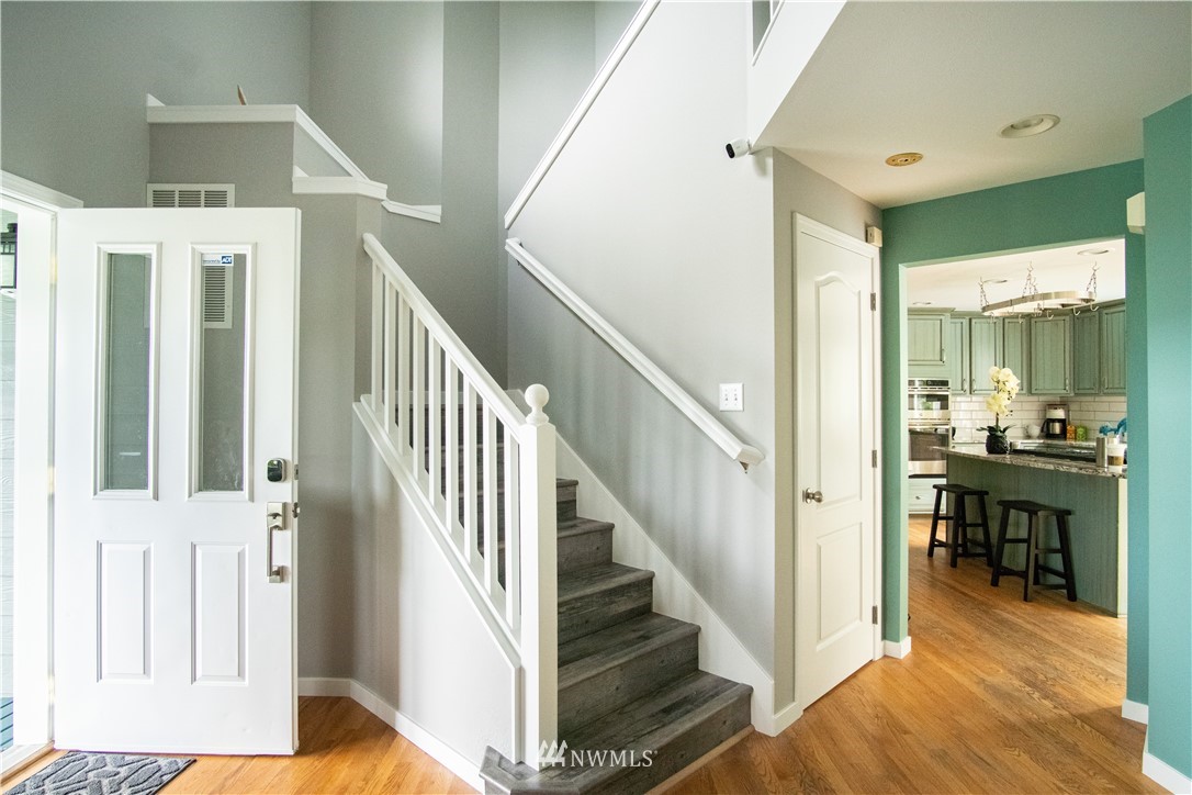 7215 South Rustic Road Seattle, WA 98178 - Photo 4 of 32 a view of entryway and hall with wooden floor