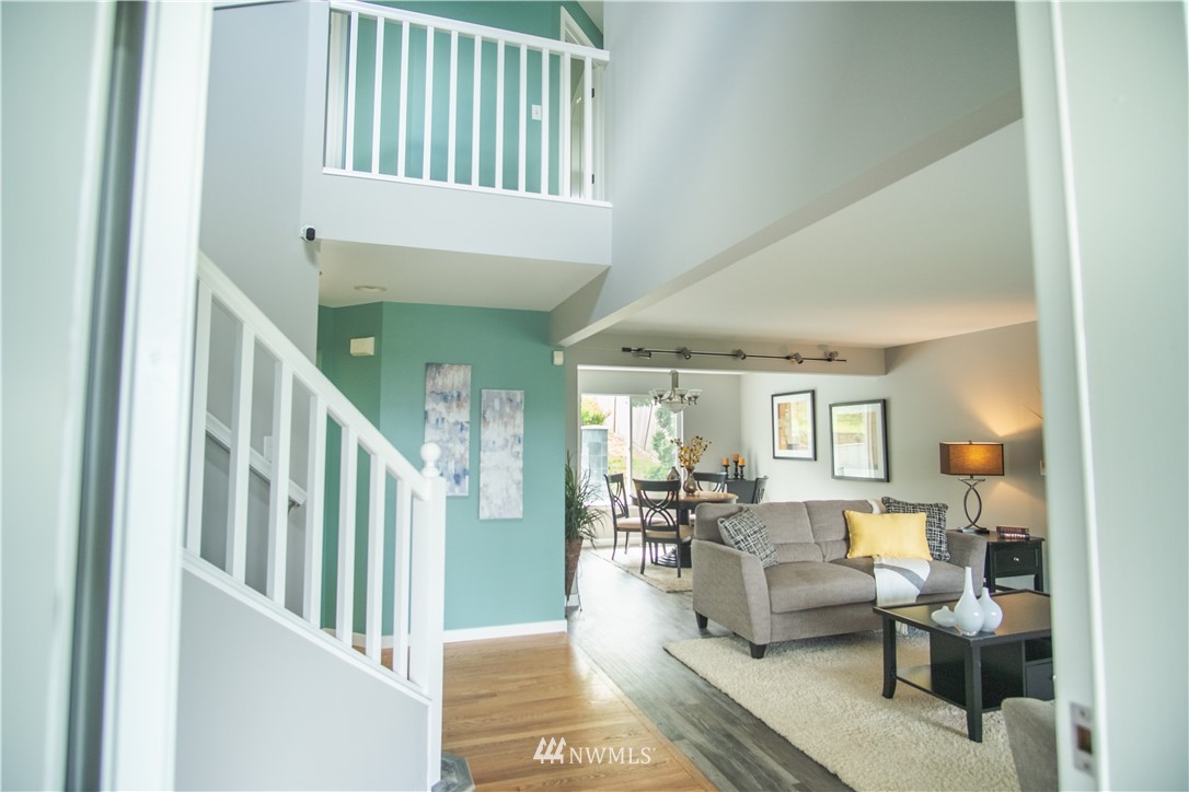 7215 South Rustic Road Seattle, WA 98178 - Photo 5 of 32 a living room with furniture and a table