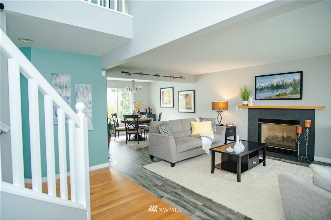 7215 South Rustic Road Seattle, WA 98178 - Photo 6 of 32 a living room with furniture and a fireplace