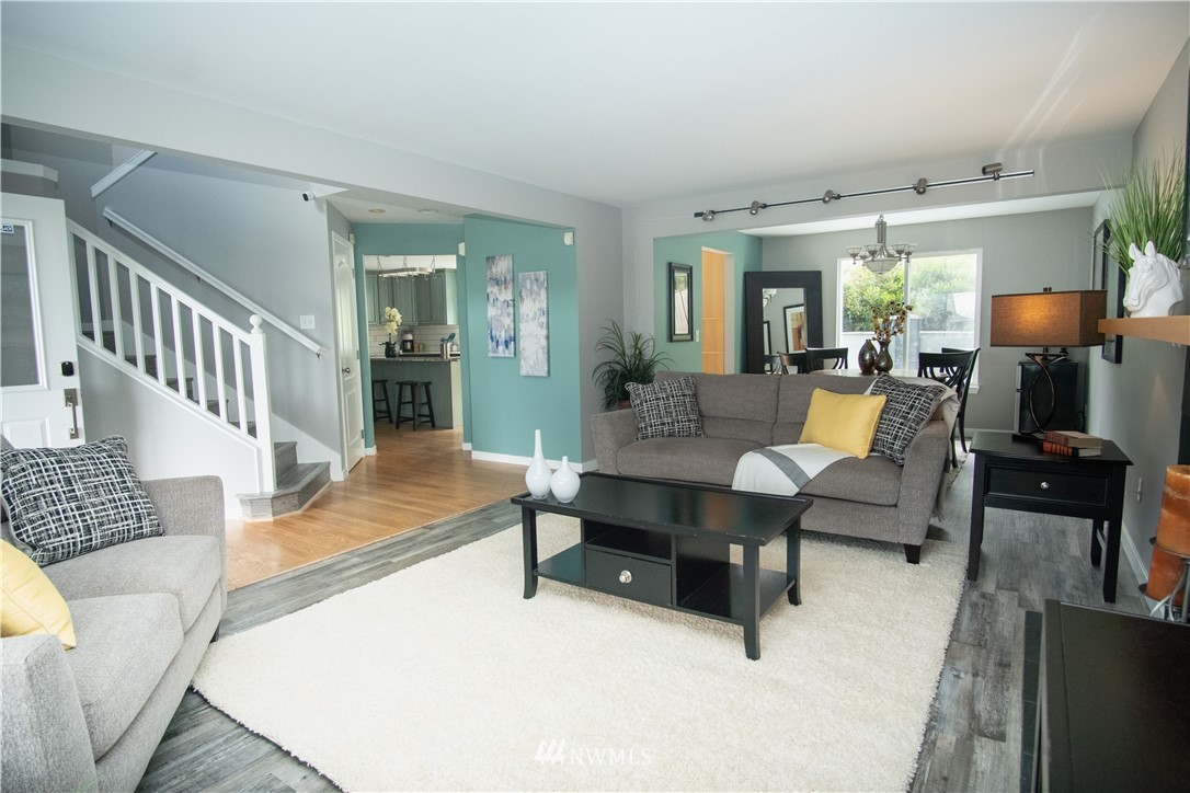 7215 South Rustic Road Seattle, WA 98178 - Photo 7 of 32 a living room with furniture and a table