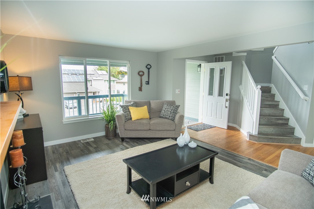 7215 South Rustic Road Seattle, WA 98178 - Photo 9 of 32 a living room with furniture and a window