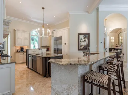 a large kitchen with granite countertop lots of counter top space