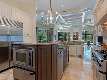 a kitchen with stainless steel appliances a stove oven and a refrigerator
