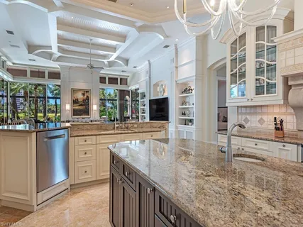 a kitchen with stainless steel appliances granite countertop a sink and cabinets
