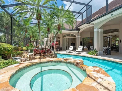a view of a swimming pool with a patio