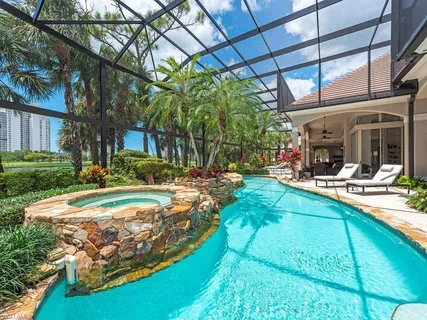 a view of a house with backyard porch and sitting area