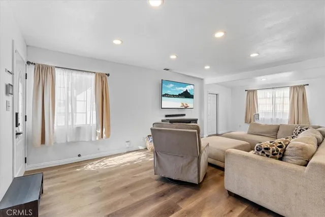 a living room with furniture and windows