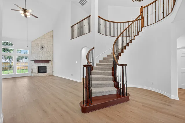 a view of entryway and hall with wooden floor