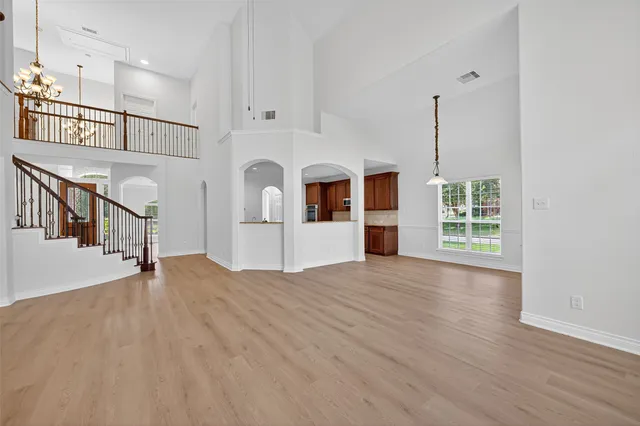 a view of an entryway with wooden floor