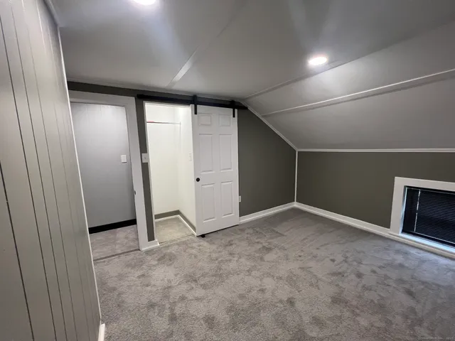 an empty room with a empty space and windows